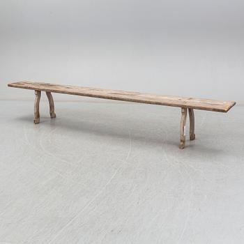 A pine bench, 19th Century.