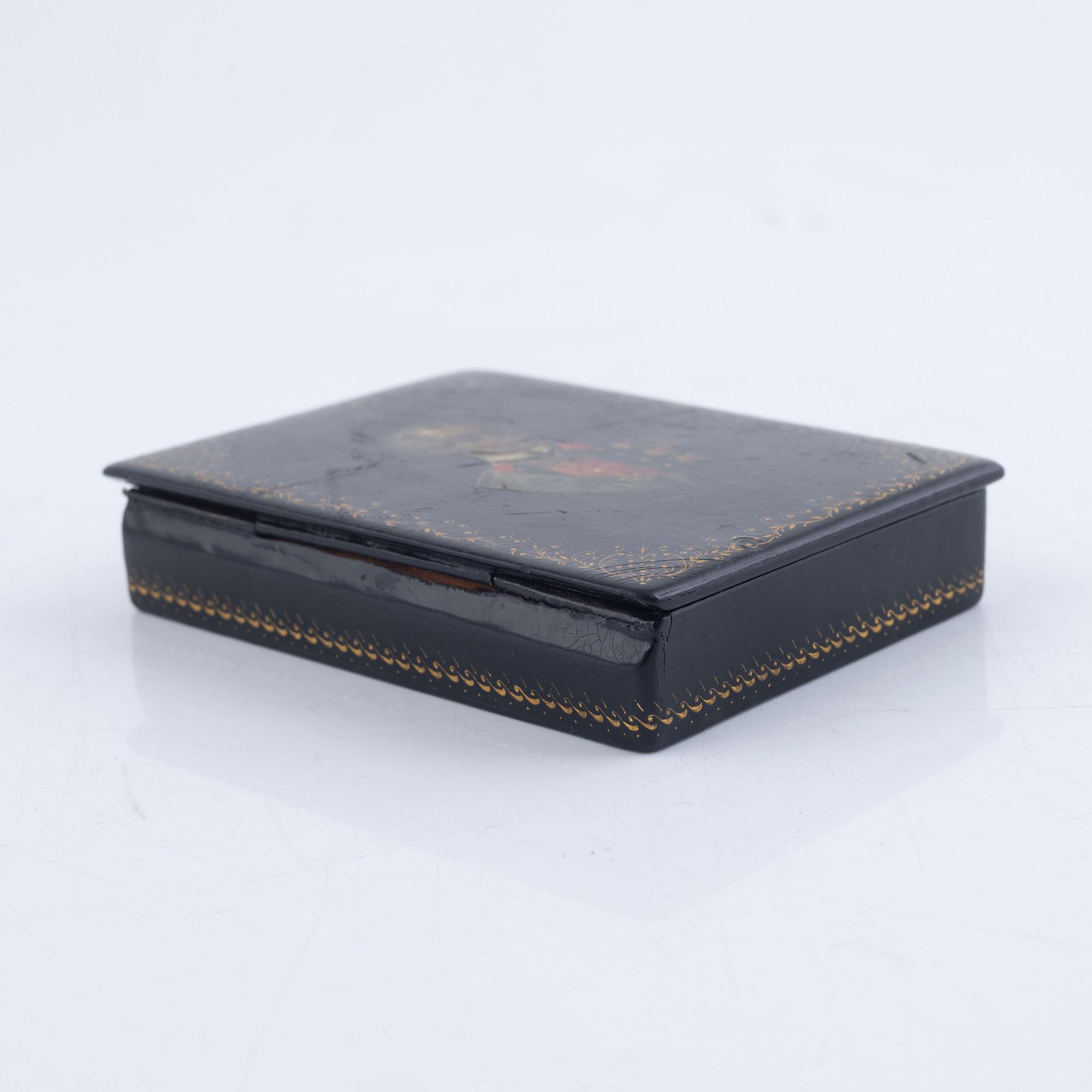 A set of three Russian lacquered papier-maché boxes, one of which from the Lukutin manufactory, 19th -20th century.