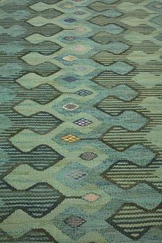 Barbro Nilsson, a carpet, "Kringelikroka, grön" ("Finspong"), flat weave, ca 227,5-231,5 x 174,5-178,5 cm, signed AB MMF BN.