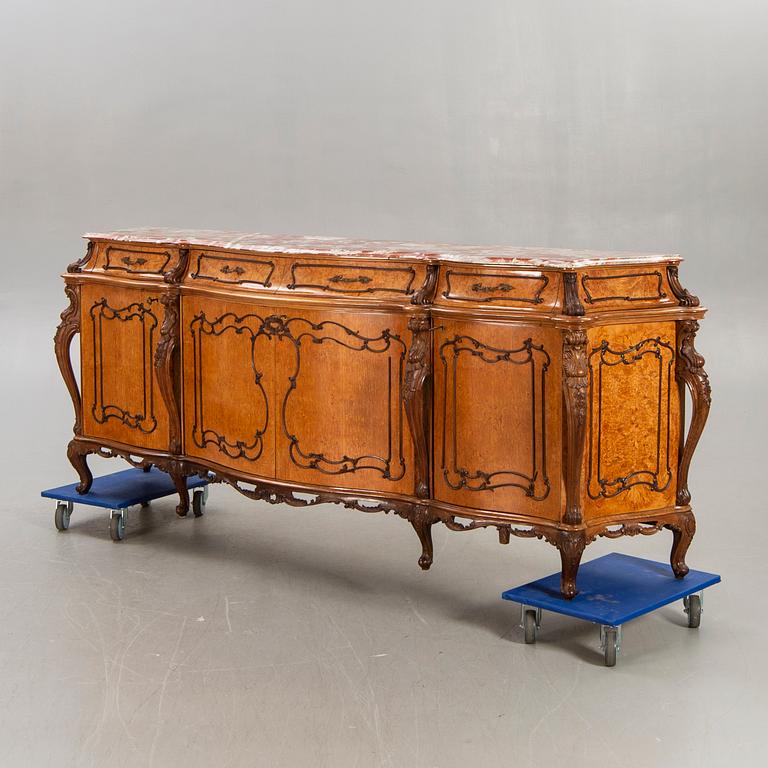 A Louis XV style birch sideboard first half of the 20th century.