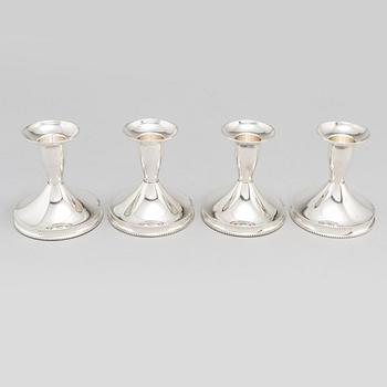 a set of four silver candlesticks by Tesi, Gothenburg 1967-1974.