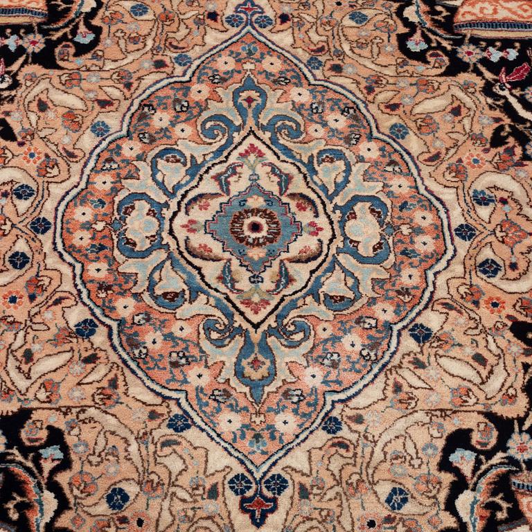 An oriental carpet, circa 390 x 302 cm.