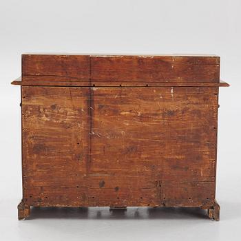 A Swedish late Baroque alder-veneered 'knee-hole' writing desk, first part of the 18th century.