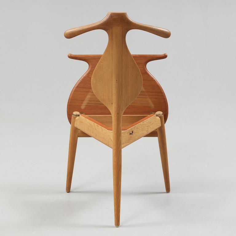 A Hans J Wegner 'Jakkens Hvile' teak chair, Johannes Hansen, Denmark.