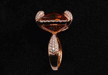 A RING, Brilliant cut dimonds c. 1.16 ct. Citrine c. 20 ct. Weight 13 g.