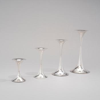 TAPIO WIRKKALA, A SET OF FOUR OF CANDLESTICKS. Signed TW. Silver 830.