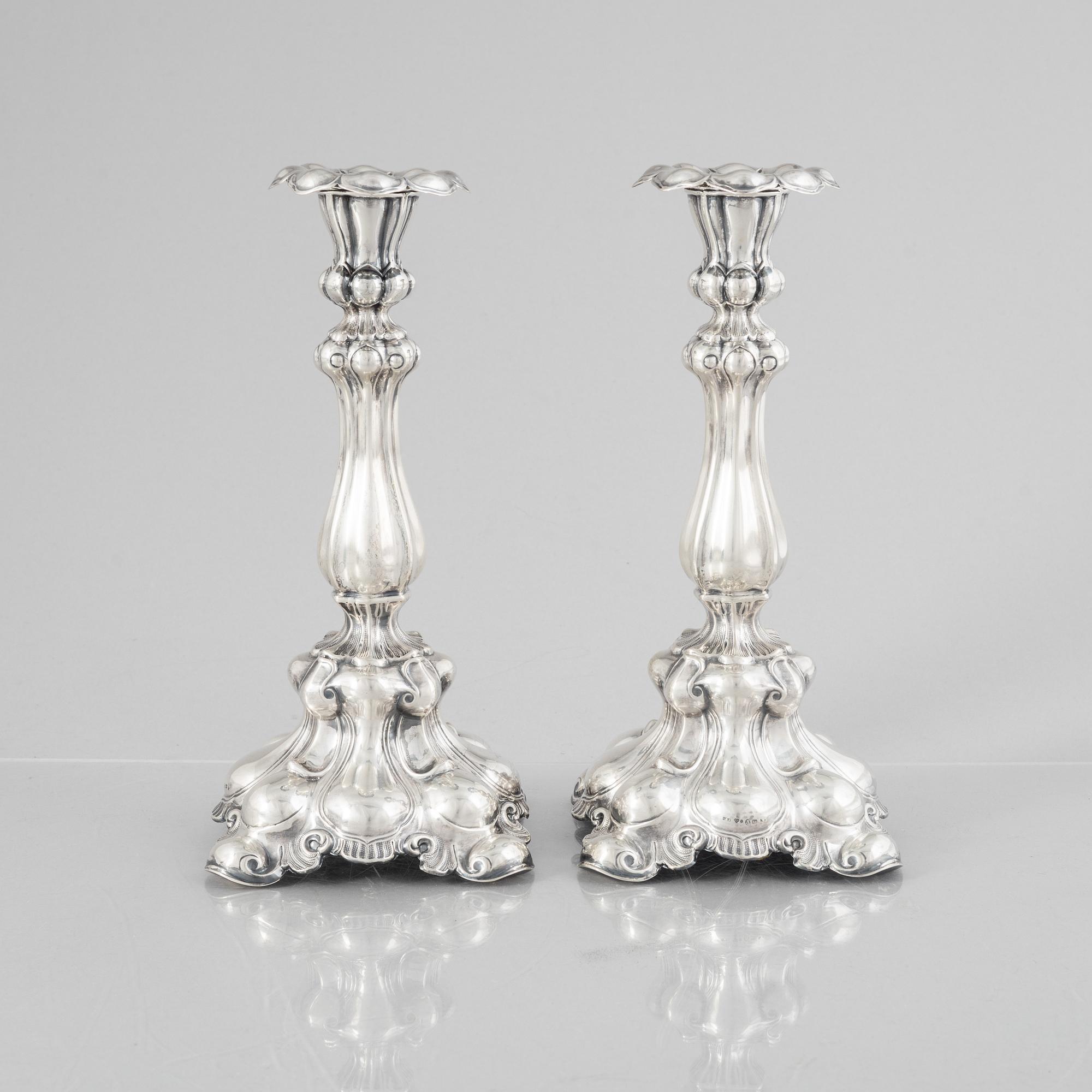 A pair of Baroque style silver candlesticks, mark of CG Hallberg 