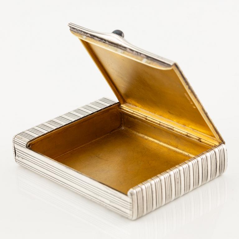 A Silver-gilt Fabergé Cigarette and Match Case, workmaster August Frederik Hollming, St. Petersburg 1908-1917.
