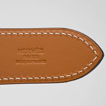 HERMÈS, a pink coral leather belt, "Etrivière".