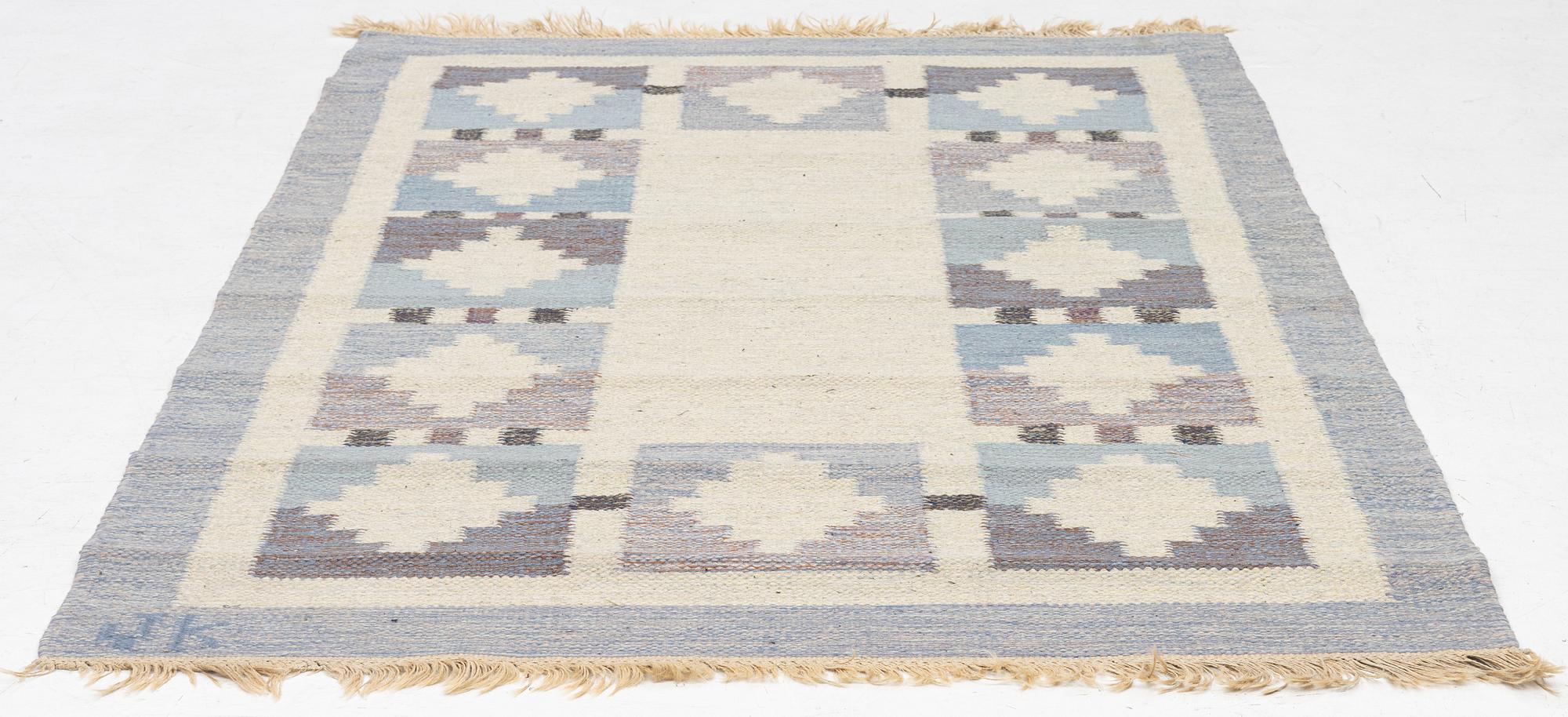 A flat weave rug, signed JK, approx. 195 x 137 cm.