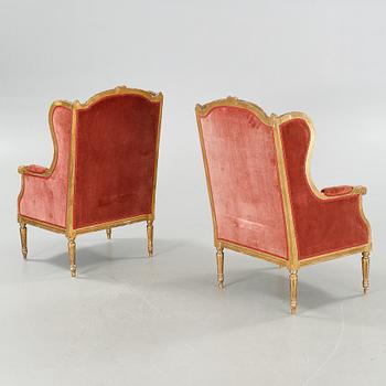 A pair of lounge chairs from the first half of the 20th century.