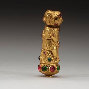 A low content chased gold Kris handle in the shape of Bima, Java or Bali, presumably 19th Century.