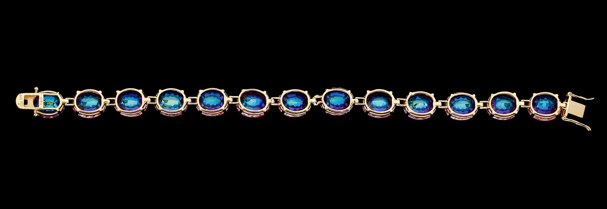 ARMBAND, förgyllt sterlingsilver, rosa behandlade topaser. Vikt ca 24,7 g.