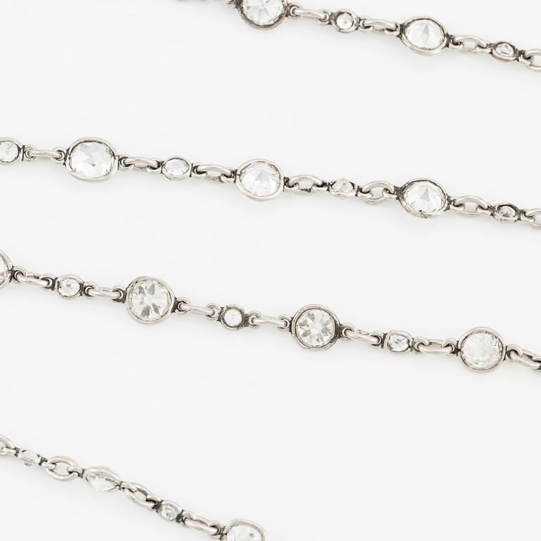 An antique platinum diamond long chain.