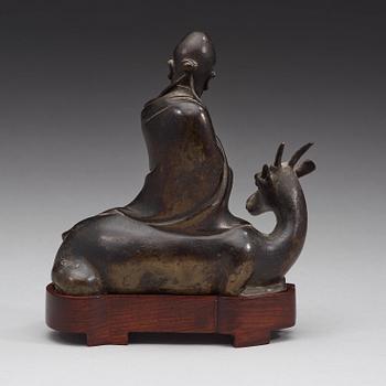 A bronze figure of Sholou on a reclining deer, Qing dynasty (1644-1912).