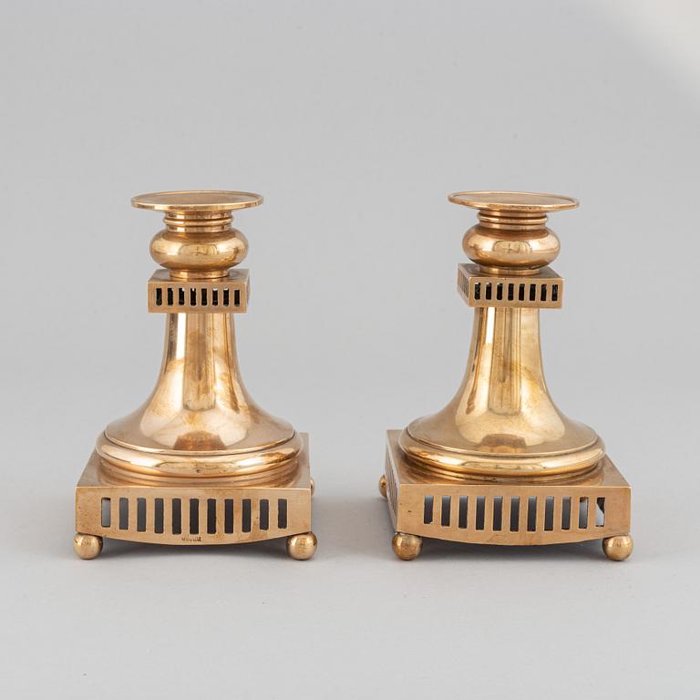 A pair of Gusum brass chandelabras, Sweden, 20th Century.