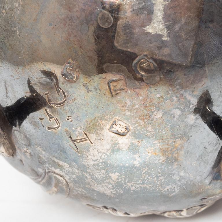 Two silver jugs, one English.