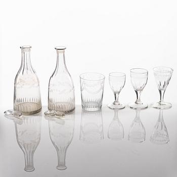 A set of two glass decanters and nine glasses, circa 1800/ early 19th Century.