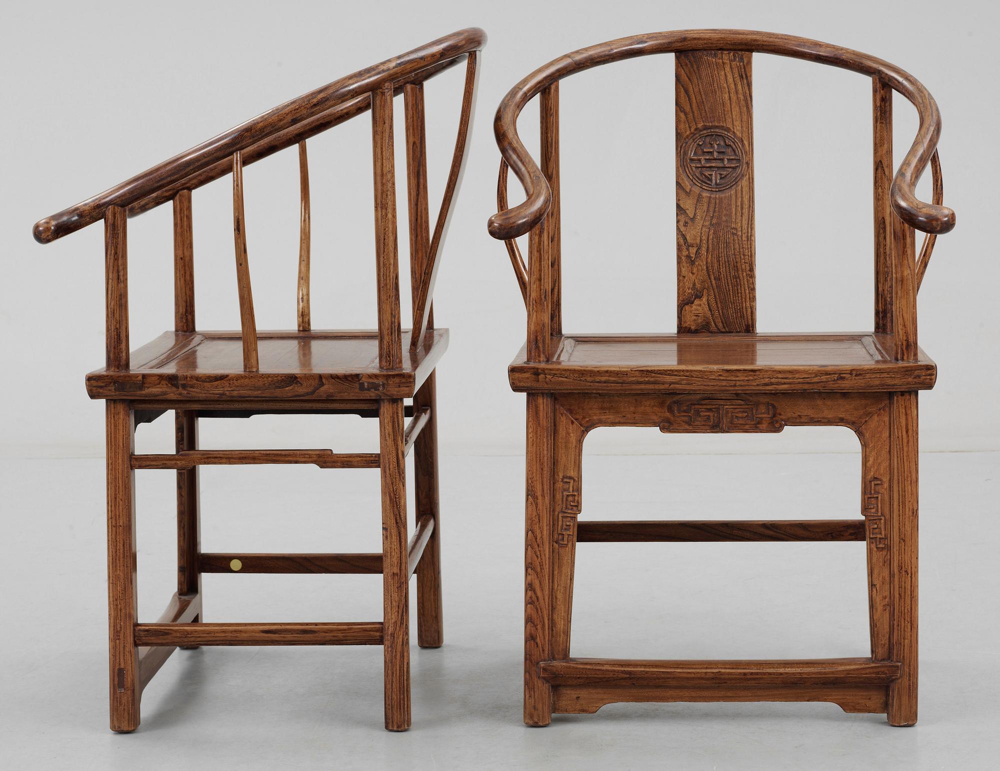 A pair of hardwood horseshoeback armchairs, Qing dynasty.