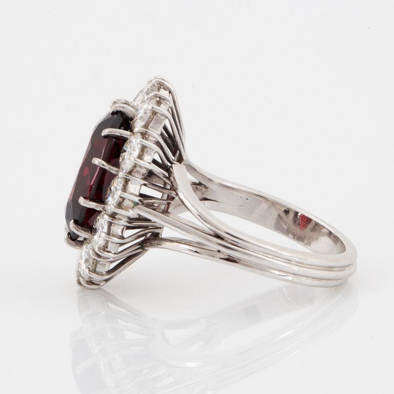 A garnet and brilliant-cut diamond ring.