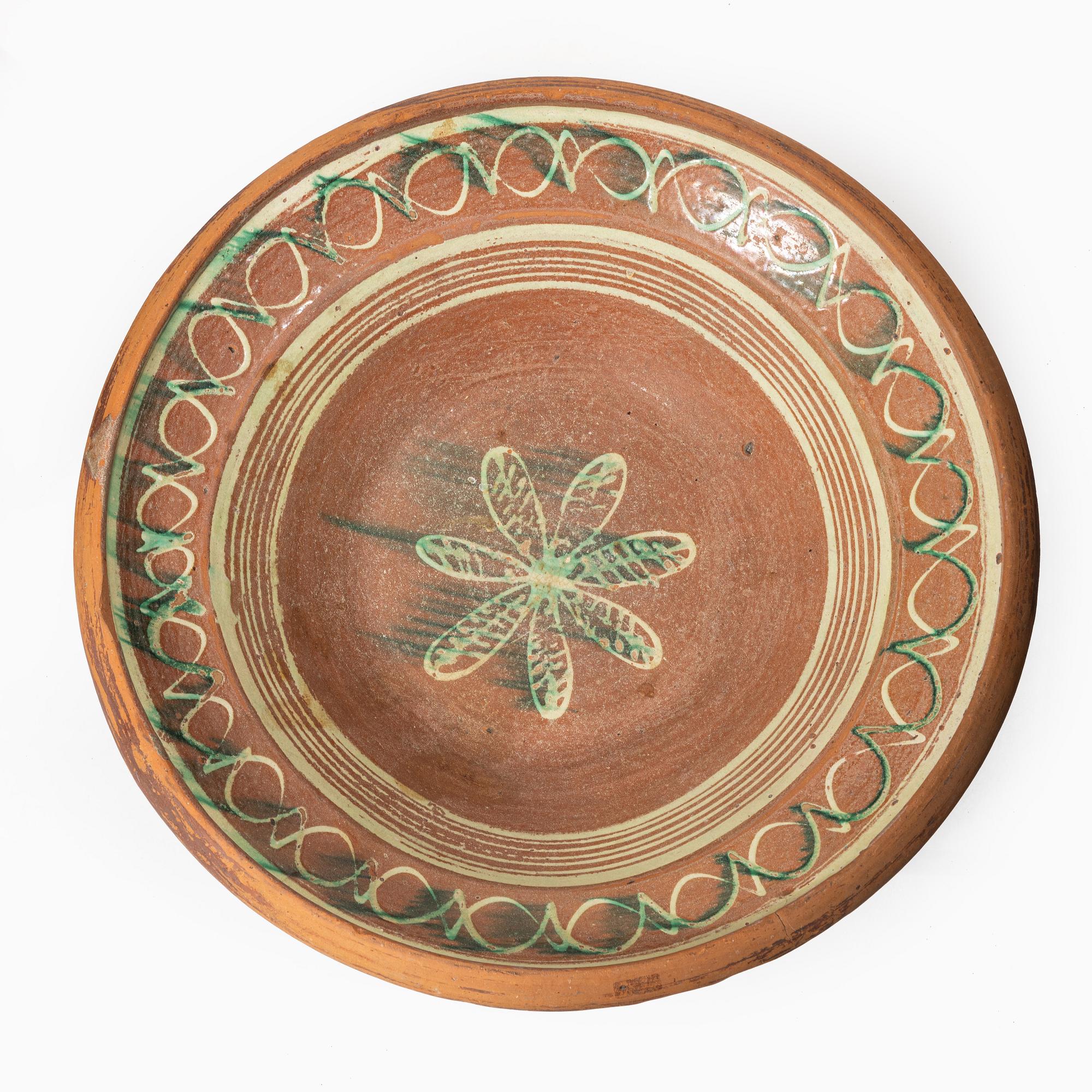 One eathenware bowl and two plates.
