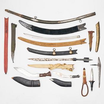 Daggers and sword scabbards, 12 pieces.