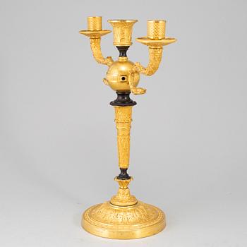 An empire ormolu candelabrum, early 19th century.