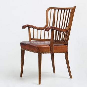 Otto Schulz, a Swedish Modern stained beech and cognac coloured leather armchair.