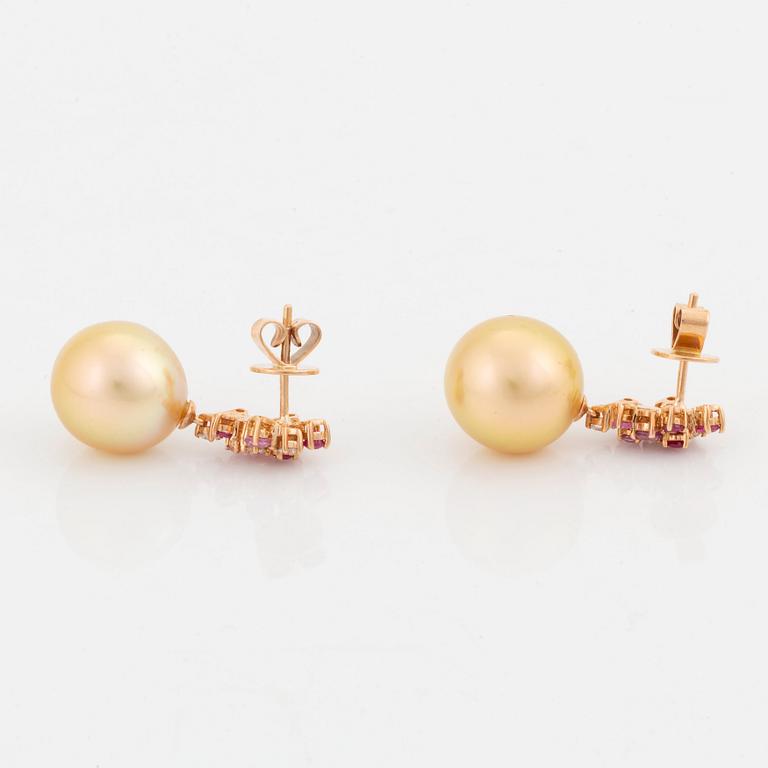 A pair of 18K rose gold cultured South Sea pearl earrings.