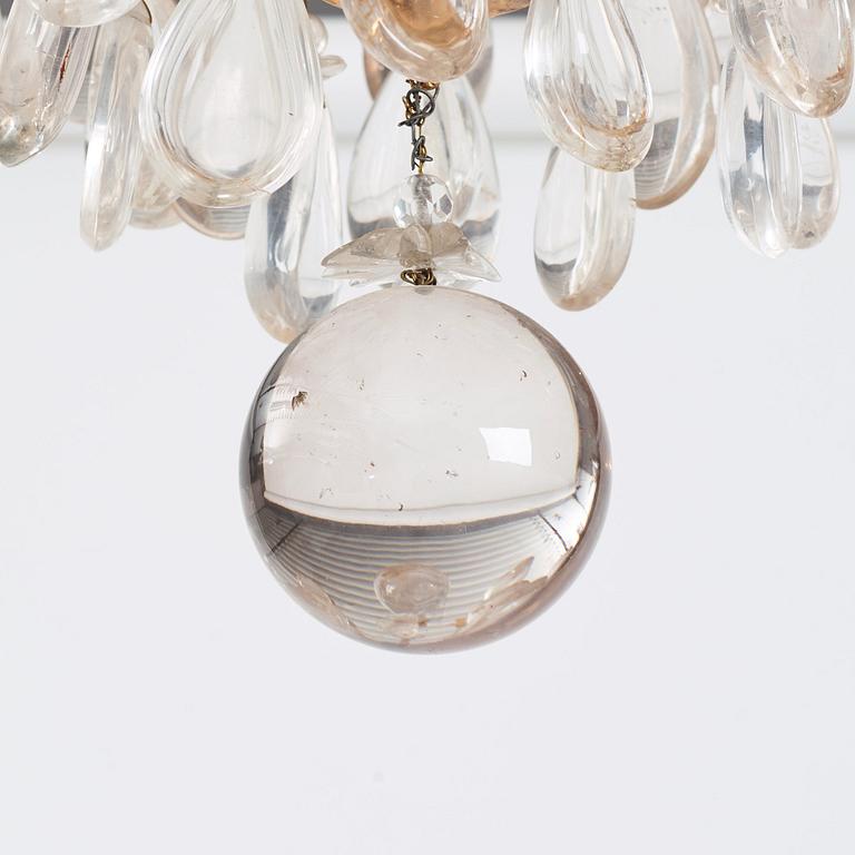 A Louis XV-style rock crystal eight-light chandelier, 20th century.