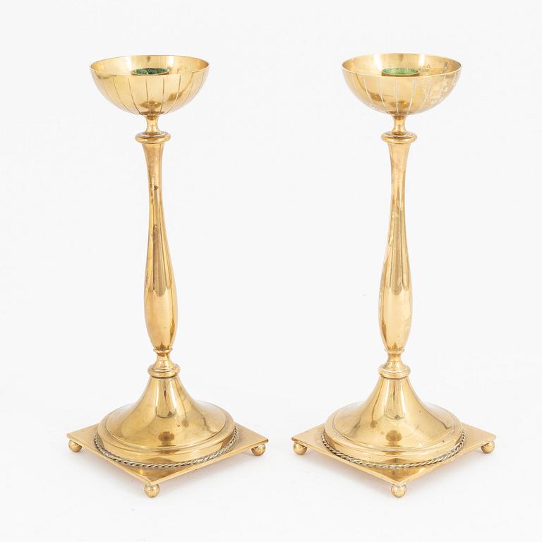 Gunnar Ander, a pair of brass candlesticks, Ystad metall, mid 20th Century.