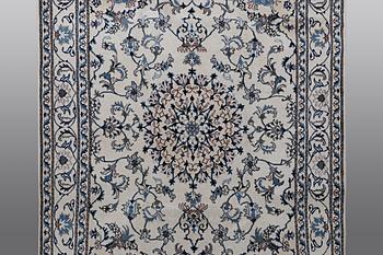 A rug, Nain, part silk, 238 x 163 cm.