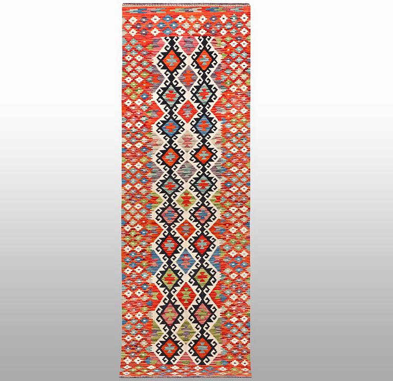 A runner kilim, ca 291 x 84 cm.