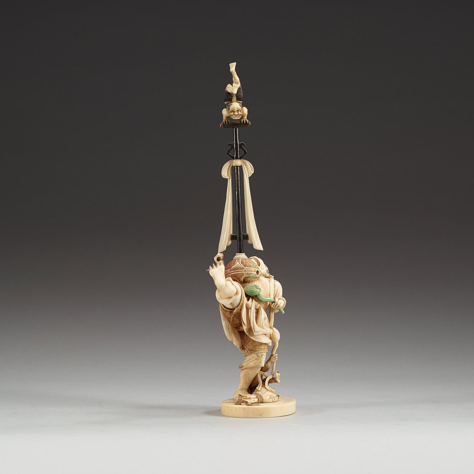 A Japanese Ivory okimono with inlays of mother of pearl and wood, Meiji period (1868-1912).