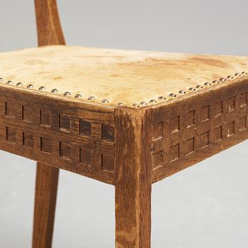 A Art Nouveau oak set with dining table, seven chairs and a side table, Finland, early 1900's.