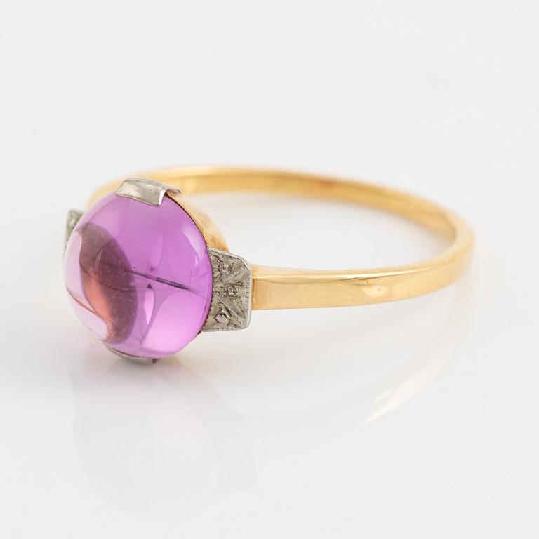 18K gold and cabochon cut syntehtic pink sapphire.