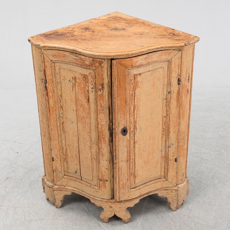 A Swedish Rococo corner cabinet, 18th Century.