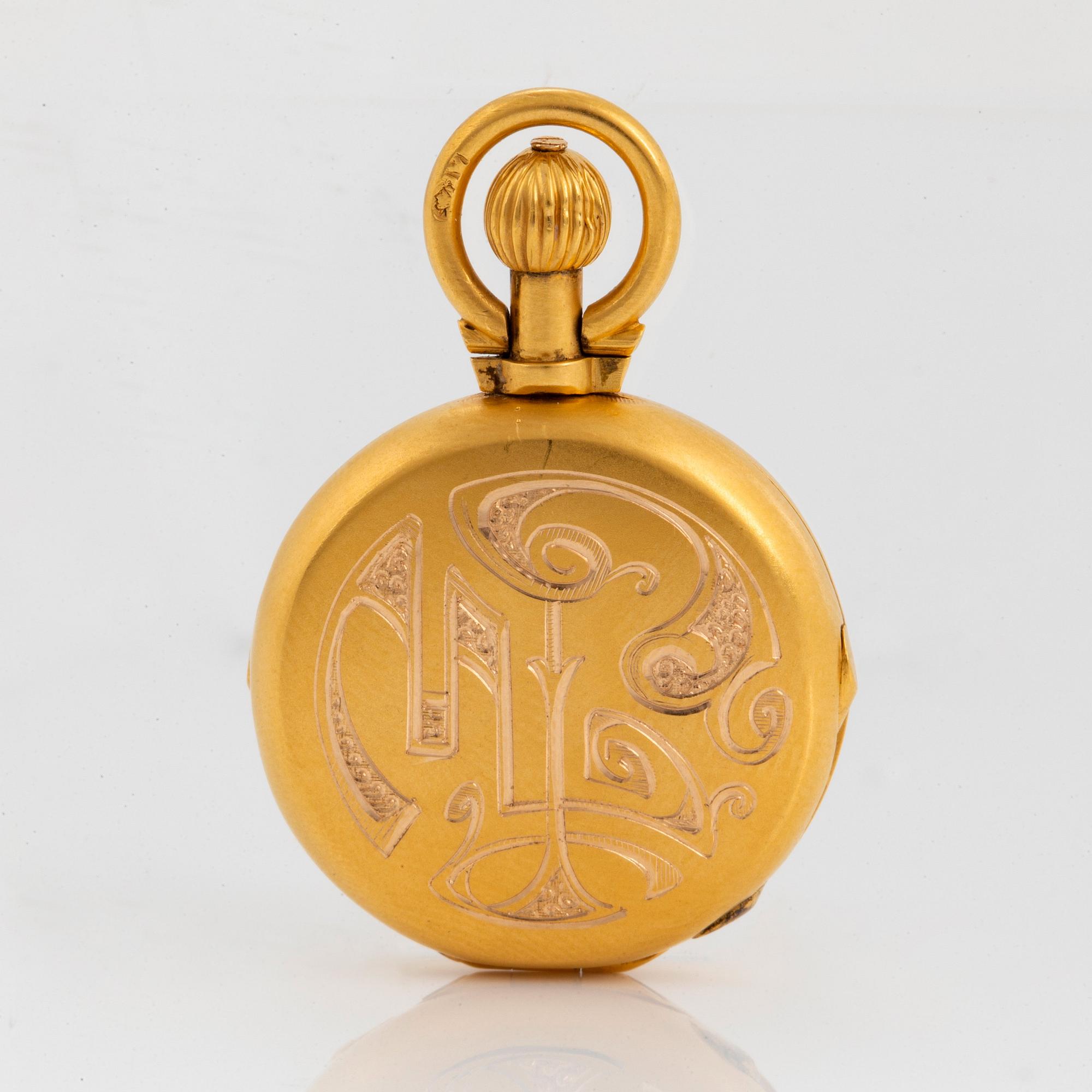 A 14K engraved gold locket.