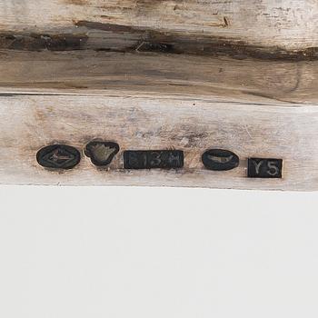 A set of two 1920s-1930s silver sweetmeat basket with sugar tong and jam spoon, Uusi Kultaseppä Oy, Helsinki, Finland.