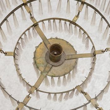A Swedish Empire-style brass and cut glass seven-light chandelier, 19th century.
