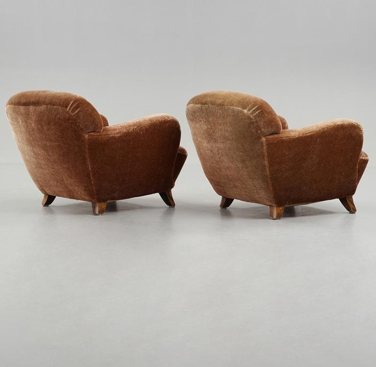 A pair of Mid century Modern easy chairs, probably 1939.