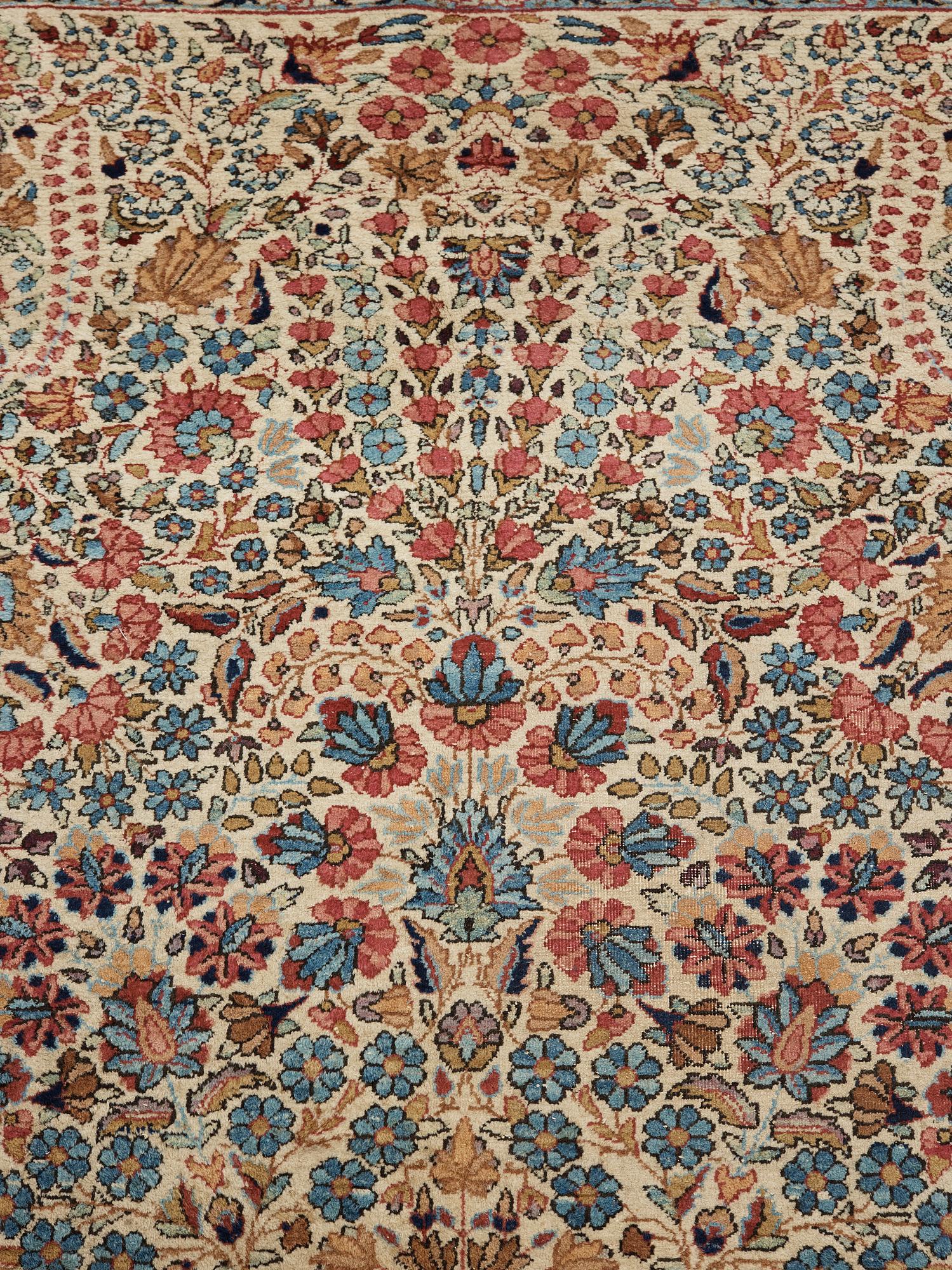 A semi-antique/old Kerman carpet, around 361 x 264 cm.