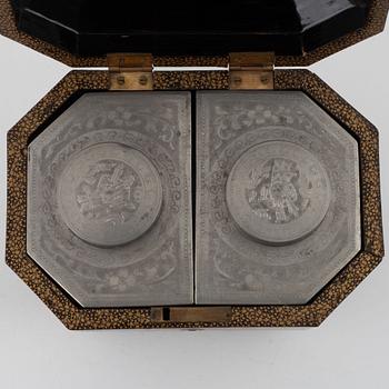 A lacquer box with pewter tea caddies, China, Qingdynasty, 19th century.