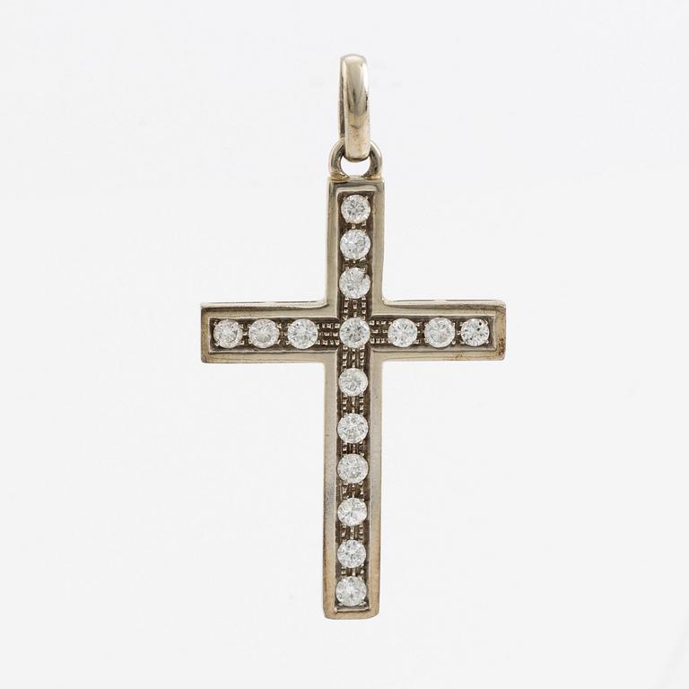 White gold and brilliant cut diamond cross pendant.