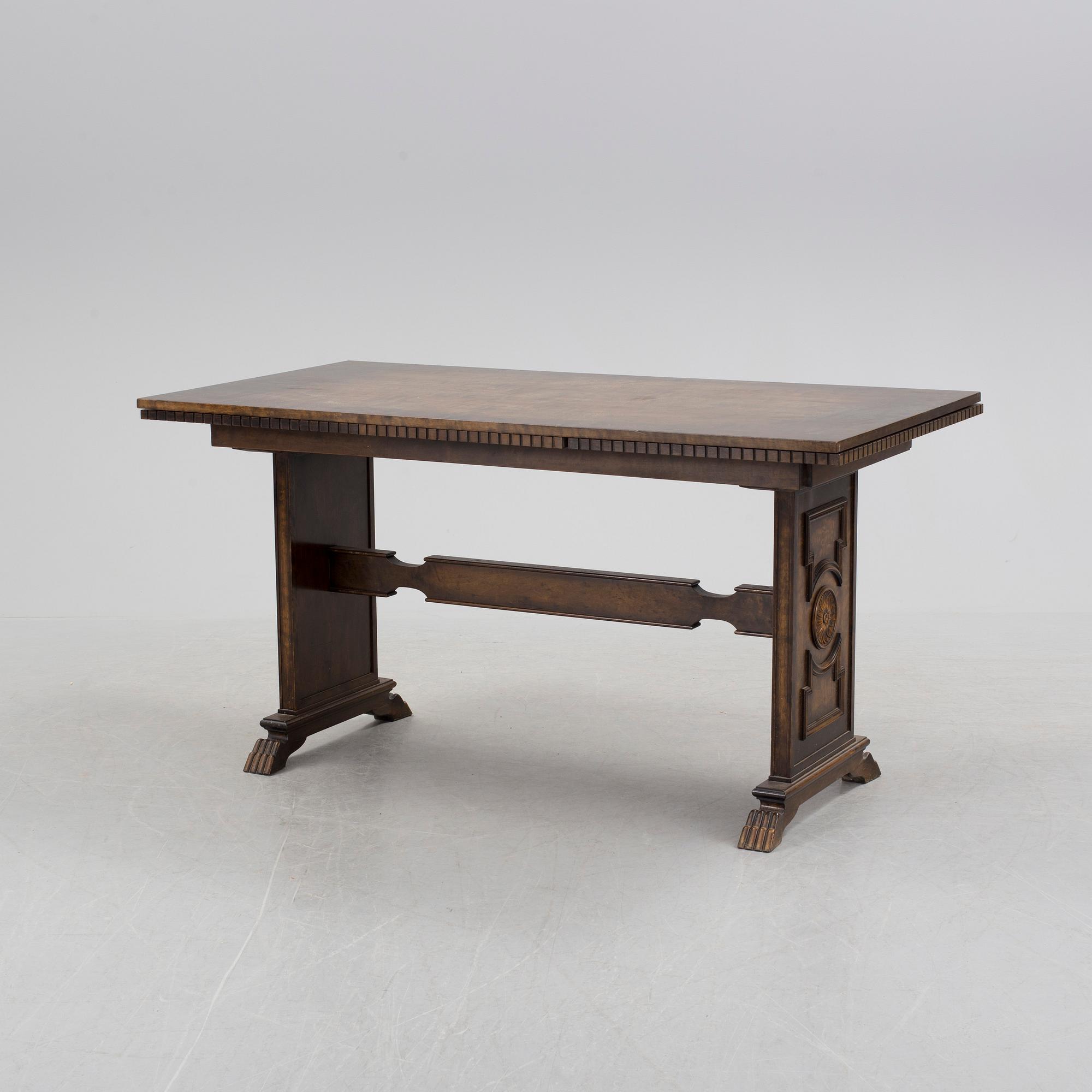 A 1920´s dinner table and six chairs probably designed by Axel Einar Hjorth for AB Svenska möbelfabriken Bodafors.