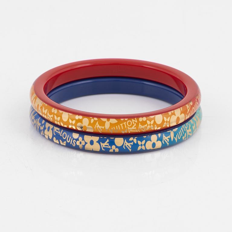 Louis Vuitton, a pair of plastic bangles.