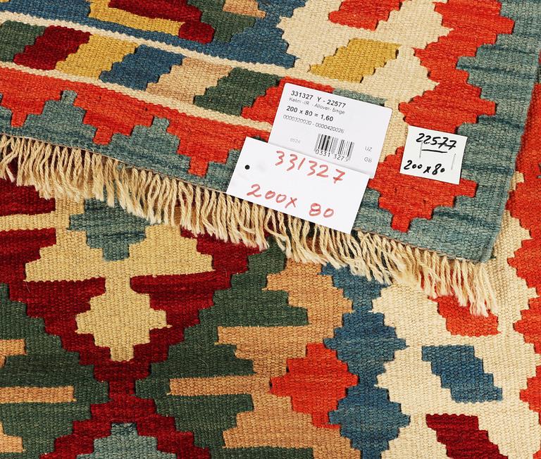An Afghan kilim runner, c. 200 x 80 cm.