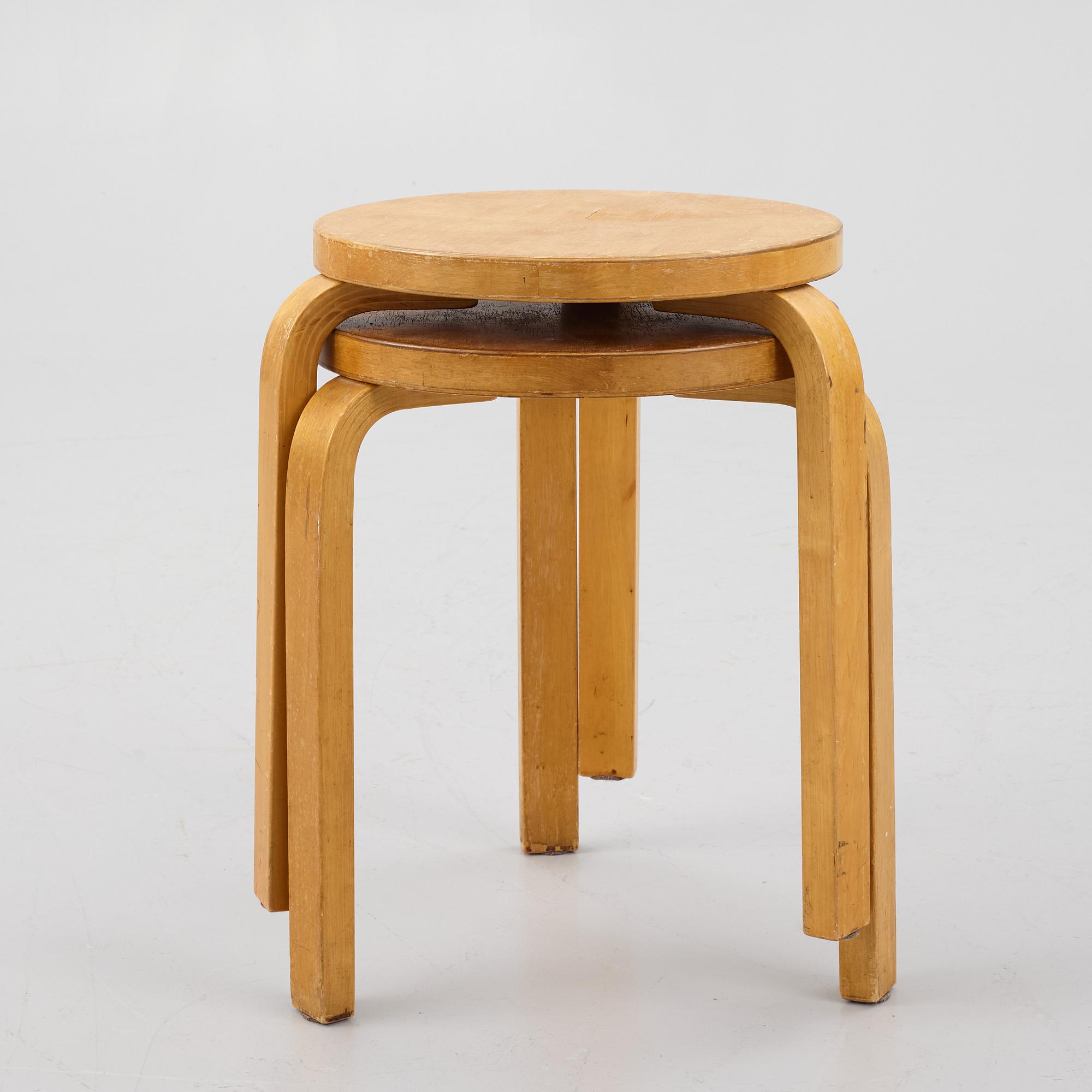 Alvar Aalto, a pair of model 60 stools, Artek, mid 20cth century.