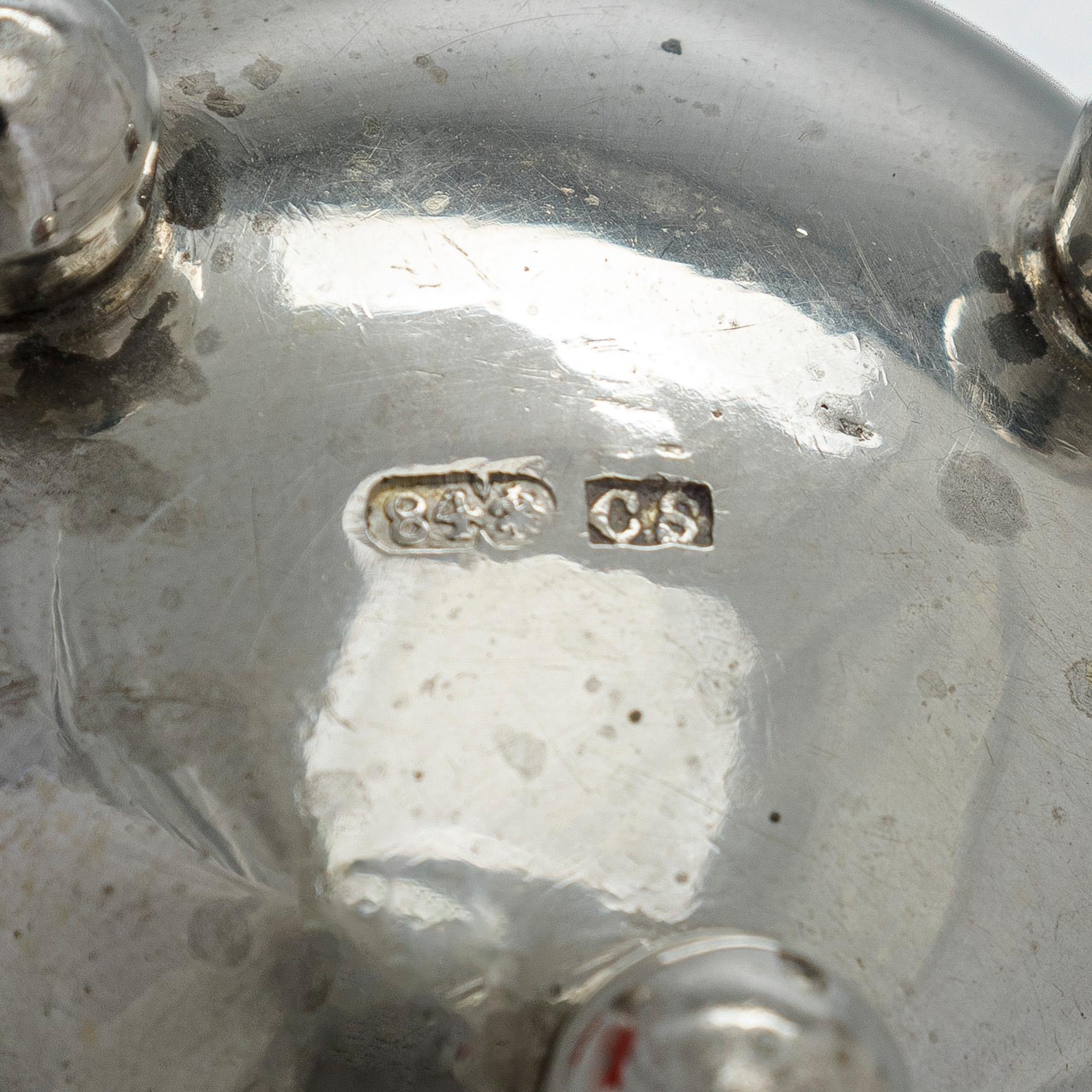 A pair of Russian silver salt cellars, a sprinkle spoon, a sauce ladle, and a tea strainer, Finnish marks.