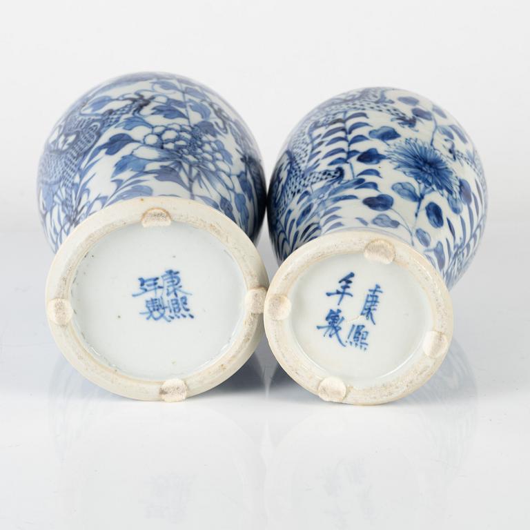 Two Chinese blue and white vases with covers, late Qing dynasty.